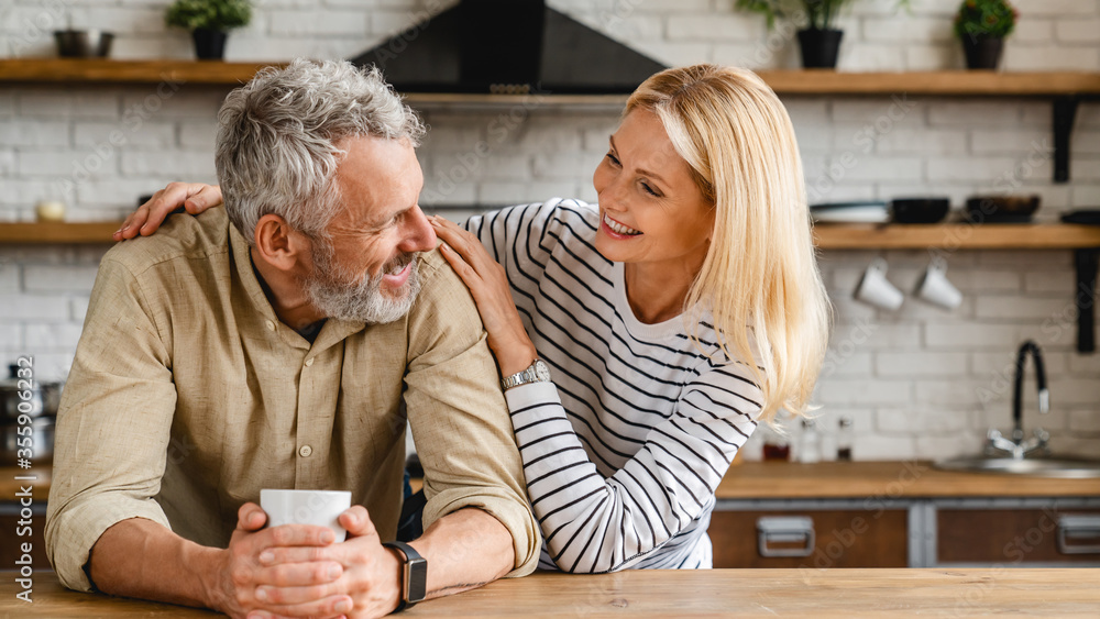 Cheerful senior couple enjoying life and fun together